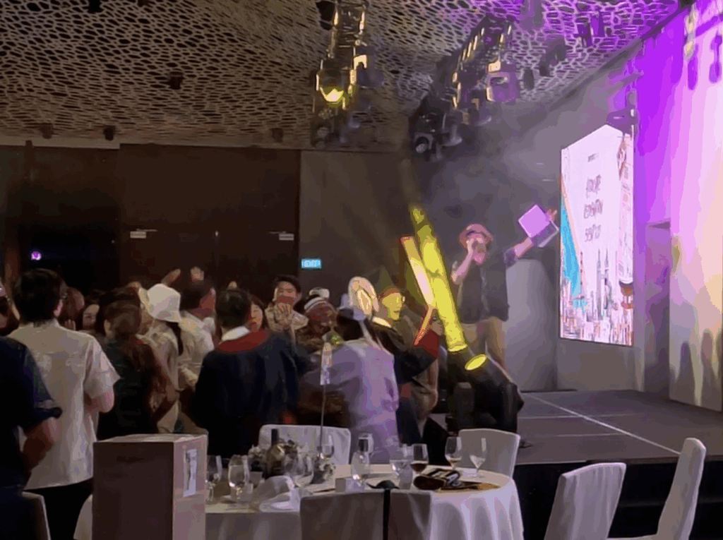An emcee, De Zhong, hosting a corporate DND at Mandai Rainforest Resort in Singapore in December